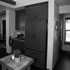 The refrigerator disappears into the cabinetry